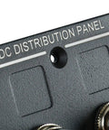 Close-up of DC distribution panel section of 4 Gang Aluminum LED Rocker Switch Panel With Circuit Breaker Waterproof Splash Proof Marine Boat RV Durable Anti Corrosion For Tough Wet Environments Ready with visible mounting hole and textured surface.