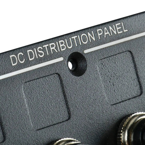 Close-up of DC distribution panel section of 4 Gang Aluminum LED Rocker Switch Panel With Circuit Breaker Waterproof Splash Proof Marine Boat RV Durable Anti Corrosion For Tough Wet Environments Ready with visible mounting hole and textured surface.