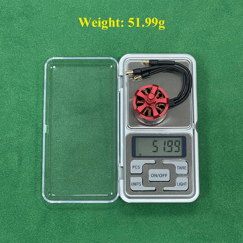 Buttery Smooth A2212 Brushless Motor Set 920KV on scale showing weight of 51.99g for drone building.