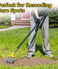 Person using Heavy Duty Rotary Cultivator With Extra Large Tines And 74 Inch Long Handle For Soil Preparation on bare patch of lawn