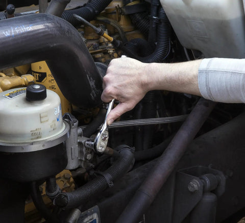Using 57 Piece Three Eighth Inch Drive Six Point Mechanics Tool Set With Standard And Deep Sockets SAE Metric on engine repairs.