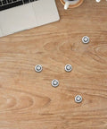 10 Pack M3 8x8.7mm Black Hard Drive Screws For Laptop And Desktop Repair scattered on wooden desk