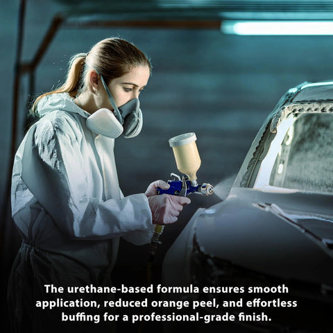 Side view of technician applying Restoration Shop 2K urethane clear coat on car with spray gun