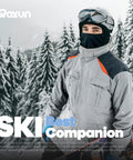Person wearing a gray jacket and a ski mask balaclava in snowy mountains, all season ski mask balaclava with windproof warmth.