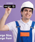 Man holding Magnetic Toolbox Labels Set With 82 Pre Printed And 8 Blank Labels For Quick Mess Free Organization in the Workshop or Garage