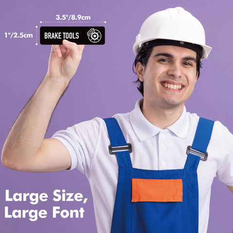 Man holding Magnetic Toolbox Labels Set With 82 Pre Printed And 8 Blank Labels For Quick Mess Free Organization in the Workshop or Garage