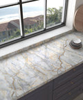 Kitchen countertop with Blue Gold Marble Contact Paper 31.5x157 In Peel And Stick Vinyl Wallpaper for desks and counters.