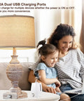 Cozy Farmhouse Table Lamp with USB charging, 3 Way Dimmable Rustic Wood Finish, illuminating living room scene with family.