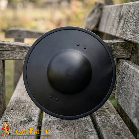 Beefy Battle Ready 11 Inch Small Medieval Buckler Shield With Rolled Rim And Riveted Grip 16 Gauge Mild Steel For LARP on bench