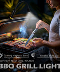 Person using LED Work Light With Magnetic Gooseneck, 500 Lumen Brightness, Beat The Dark Zoomable Flexible Flashlight on BBQ grill