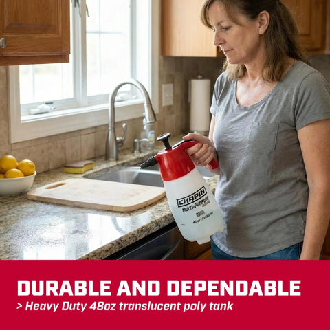 Person holding 48oz Handheld Pump Sprayer for Lawn and Garden with Wide Mouth Translucent Poly Tank at kitchen sink