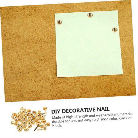 Image of 200Pcs DIY Craft Nails For Wall Hangings And Scrapbooking Kit with white paper tacked to cork board using brass pin fasteners.