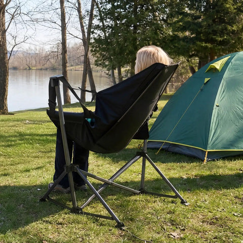 Heavy Duty Folding Hammock Chair With Adjustable Backrest For Camping, Travel, And Patio next to tent, person seated