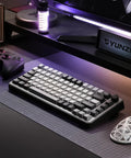 Kickass 75 Percent Tri Mode Wireless Mechanical Keyboard With Hot Swap Keys And Large 4000 Mah Battery For Smooth Typing Vibes And Heavy Gaming Flows In Dark Grey Finish on a gaming desk.