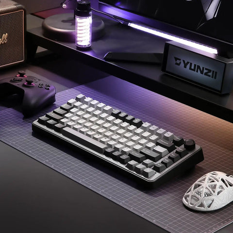 Kickass 75 Percent Tri Mode Wireless Mechanical Keyboard With Hot Swap Keys And Large 4000 Mah Battery For Smooth Typing Vibes And Heavy Gaming Flows In Dark Grey Finish on a gaming desk.