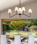 Awesome 39 Inch Matte Black Six Light Kitchen Island Chandelier With Fabric Shade in dining room setting.