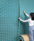 High Density Sound Proofing Foam Panels With Reliable Self Adhesive Back For Studio Home Office Noise Killer Fire Resistant Acoustic Tiles being applied on wall.
