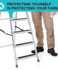 Worker near ladder using Anti Slip Traction Tape 2 Inch By 38 Foot Durable Non Slip Grip For Stairs Treads Indoor Outdoor Heavy Foot Traffic With Strong Adhesive For Steps Deck Garage And Home Safety For Everyday Safe Use