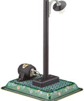 Model of urban street lamp with black post on decorative base
