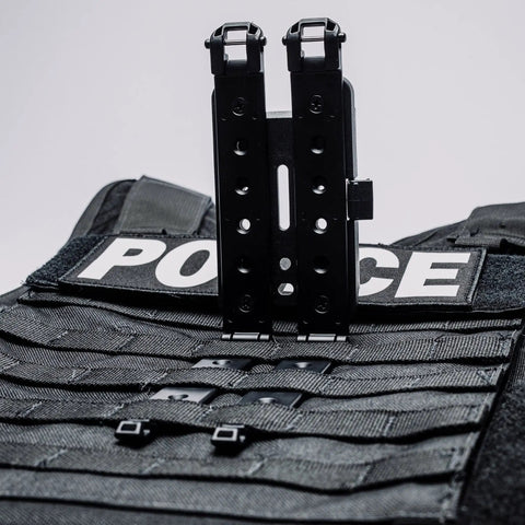 Rock Solid 3 Inch Molle Lok Clips attached to a tactical vest, durable nylon material for easy gear access.