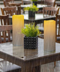 Waterproof Outdoor Flameless Pillar Candles 10x5 Inch Battery Operated LED With Remote And Timer on wet patio table