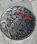 Rock Solid T Shaped Manhole Cover Lifter Hook Forged From Reinforced Steel Rod with no slip grip on decorative manhole cover.