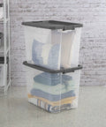 Heck Yeah 2 Pack 108 Quart Stackable Storage Containers With Deep Recessed Latch Lids clear plastic bins stacked with blankets.
