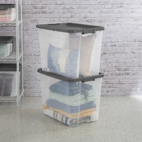 Heck Yeah 2 Pack 108 Quart Stackable Storage Containers With Deep Recessed Latch Lids clear plastic bins stacked with blankets.