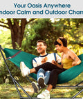 Two people relaxing outdoors on Foldable Hammock Stand For Camping And Home Use, Collapsible Double Hammock Set in Peacock.