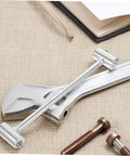 Adjustable Hinge Wrench For Door Gaps Pro Grade Heavy Duty Tool Kit displayed on a workbench with bolts and a wrench
