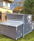 Sturdy Large Wooden Chicken Coop with Weatherproof Exterior and Six Nesting Boxes, Removable Tray, Dark Grey Finish in Backyard