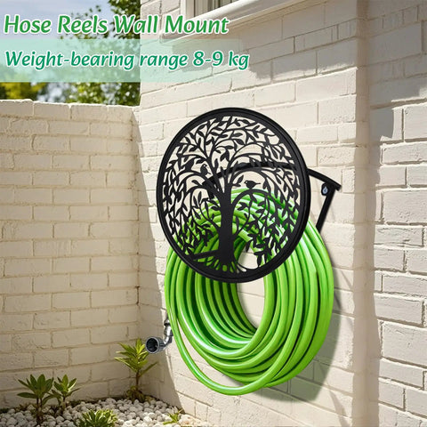 Heavy Duty Outdoor Garden Hose Reel and Wall Mount Holder With Tree of Life Metal Design mounted on brick wall with green hose
