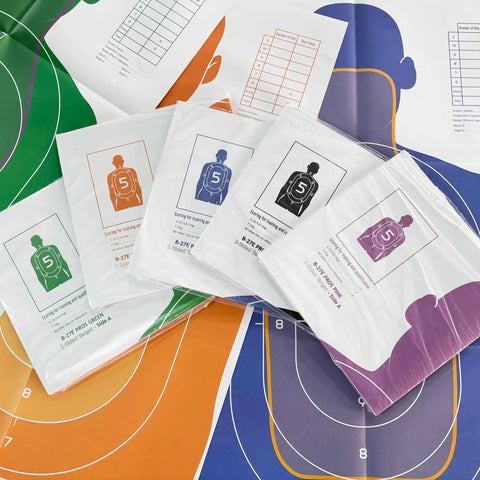 Double Sided Shooting Targets 5 Pack 23 By 35 Inches Full Size B-27E PROS And FBI-Q in various colors on paper sheets.