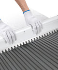 Hands using Heavy Duty 30 Inch Square Notched Tile Trowel For Large Tiles And Thick Bed Mortar Pro Grade Aluminum Alloy Frame