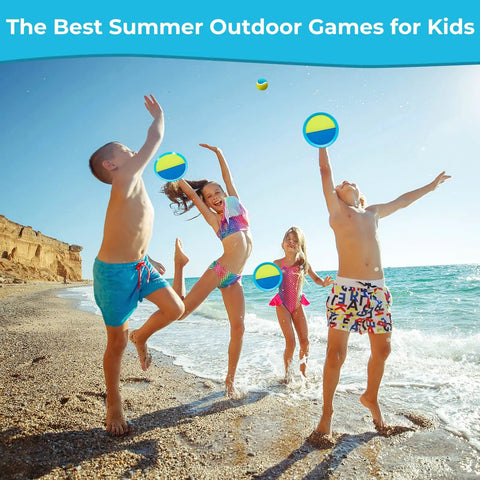 Kids playing with Outdoor Toss And Catch Ball Set For Kids Beach Toys And Backyard Games at the beach, smiling, sunny day.