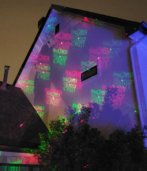 Motion Pattern Firefly 3 In 1 RGB Outdoor Laser Christmas Lights Projector With 18 Moving Patterns projecting on house