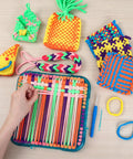 Easy Potholder Loom Craft Kit For Kids And Beginners with rainbow loops, weaving tool, and completed colorful potholders.