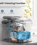 Transparent view of Portable Countertop Ice Maker With Handle Delivers 9 Bullet Shaped Ice Cubes In About 6 Minutes 26 Lbs Per Day Self Cleaning Function Includes Ice Scoop And Basket For Home Kitchen Party Ready Grey on countertop.