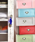 Antique Bronze Card Catalog Drawer Pulls on colorful file cabinets for office furniture and vintage library use.