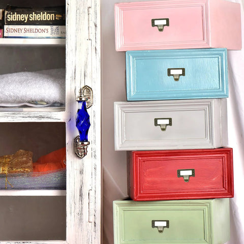 Antique Bronze Card Catalog Drawer Pulls on colorful file cabinets for office furniture and vintage library use.