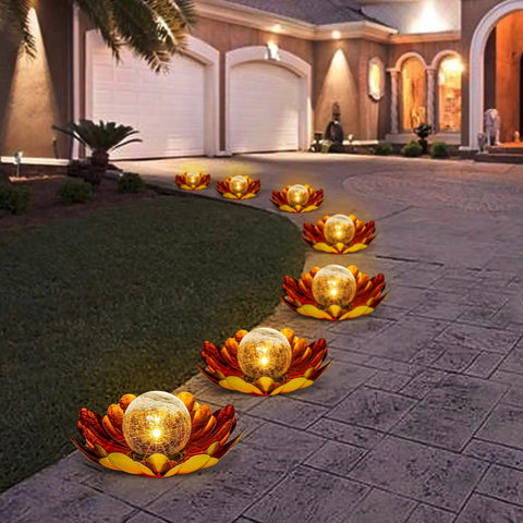 Solar Lotus Flower Light Outdoor Decor for Garden Backyard Waterproof Metal Yard Ornament lighting a walkway at night.