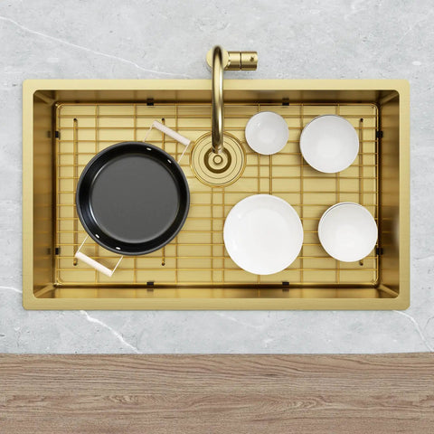 Rock Solid Gold 304 Stainless Steel Sink Grid Protector Covers 28 by 14 Inch Single Bowl with Rear Drain holding cookware in sink.
