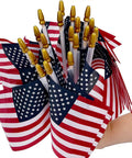 Hand holding Pack Of 100 Small 4x6 Inch American Flags On 12 Inch Wood Sticks For Outdoor Use, ideal for patriotic events.
