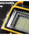 Close-up of JUDYSSY 800W Led Rechargeable Floodlight Waterproof showing water resistance with droplets on the surface.