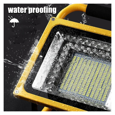 Close-up of JUDYSSY 800W Led Rechargeable Floodlight Waterproof showing water resistance with droplets on the surface.
