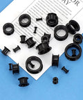 26 Piece Silicone Ear Tunnels Set 8G To 1 Inch Hollow Flexible Soft Ear Stretching Kit on paper background