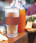 Level Up Your Chill Game With These Freezable Pint Glasses Double Walled Insulated Tumblers That Keep Beer And Iced Coffee Straight Frosty Built To Last Set Of Two Wooden Handles, showing icy drink in double walled tumbler.