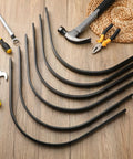 Six Pack Heavy Duty Rock Rake Tines Replacement for Landscape Rakes One Inch by Five Sixteenth Inch on wood floor with tools