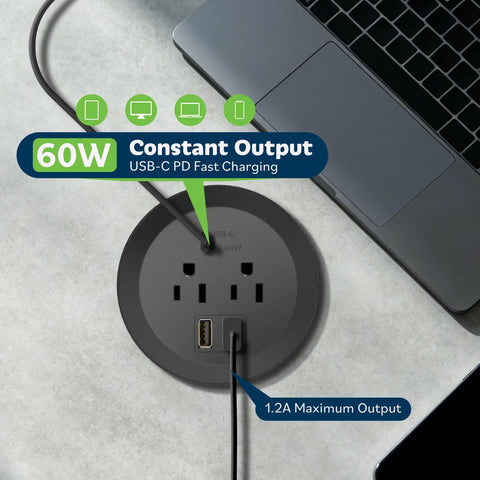 GaN Desk Grommet Power Hub With 65W USB C PD 2 USB A Ports And Duplex Outlet 3 Inch Circular Grommet in black on desk