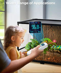 Child observing reptile tank with 2-In-1 Infrared Thermometer Gun With Meat Probe Handy Digital Laser Temp Meter in use